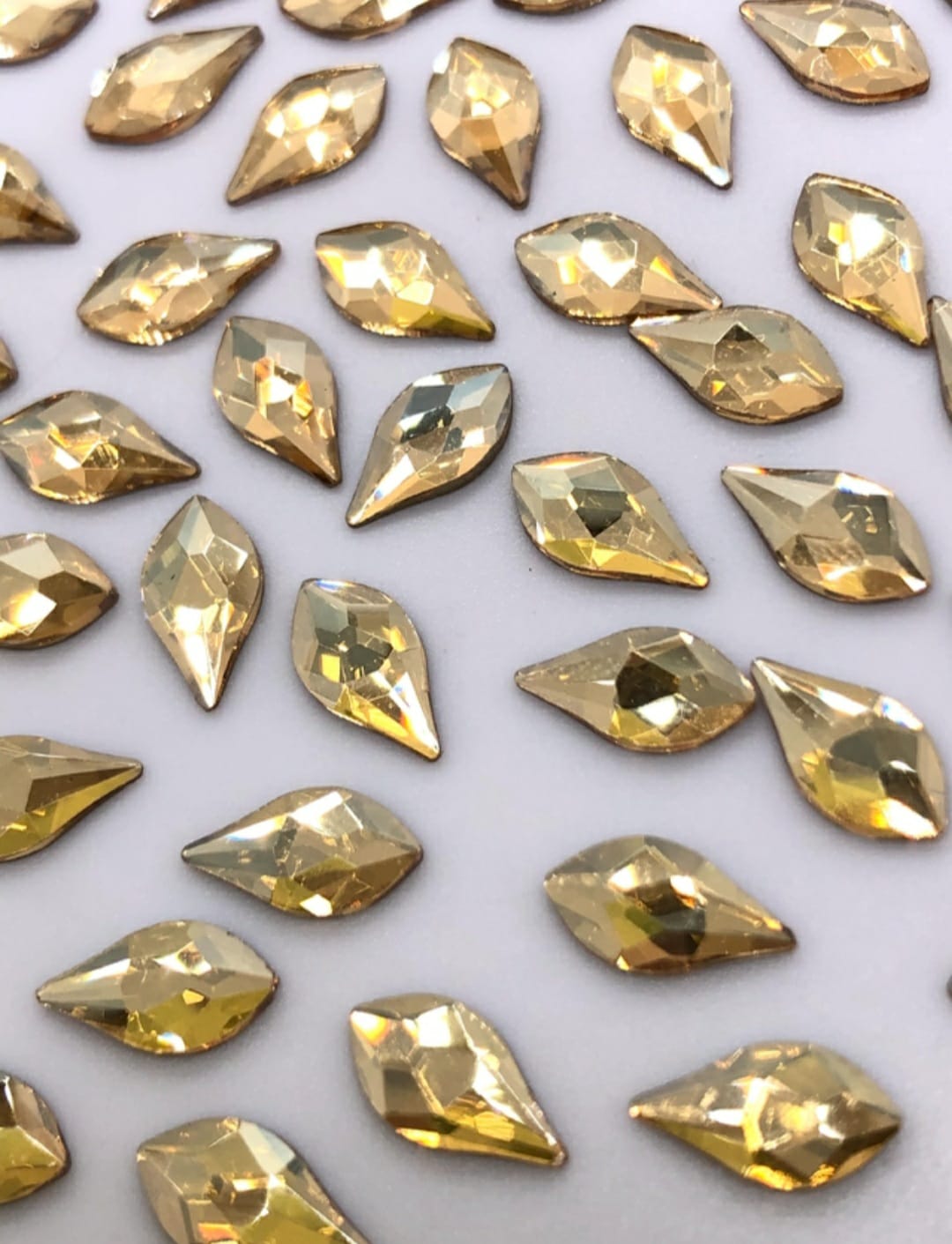 CRISTAL FLAMA 5X10MM (10 UNIDADES) CHAMPGNE